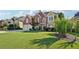 Charming brick home featuring a well-manicured lawn and a two-car garage, set under a bright, partly cloudy sky at 2909 Everson Ridge Ct, Snellville, GA 30039