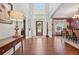 Bright foyer with hardwood floors, a decorative front door, and views into the formal dining and living spaces at 2909 Everson Ridge Ct, Snellville, GA 30039