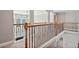 Bright hallway with detailed railing, arched windows, and ample natural light at 2909 Everson Ridge Ct, Snellville, GA 30039