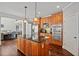 Spacious kitchen with island, granite counters, stainless steel appliances, and hardwood floors at 2909 Everson Ridge Ct, Snellville, GA 30039
