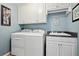 Well-equipped laundry room with modern washer, dryer, and ample storage space at 2909 Everson Ridge Ct, Snellville, GA 30039