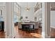 Bright living room with high ceilings, large windows, hardwood floors, and a piano at 2909 Everson Ridge Ct, Snellville, GA 30039