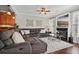 Comfortable living room with a sectional couch, fireplace, and elegant decor at 2909 Everson Ridge Ct, Snellville, GA 30039