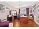 Home office featuring a large window, hardwood floors, a desk, and ample storage at 2909 Everson Ridge Ct, Snellville, GA 30039