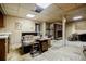 Unfinished basement with exposed ceilings, wood-burning fireplace, and a bar area at 3294 Francine Dr, Decatur, GA 30033