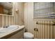 A functional bathroom includes a vanity, toilet, and window, designed for essential needs at 3294 Francine Dr, Decatur, GA 30033