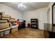 Bedroom features hardwood floors, a ceiling fan, and a dresser at 3294 Francine Dr, Decatur, GA 30033