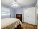 Bedroom with wood floors, neutral walls and access to a closet at 3294 Francine Dr, Decatur, GA 30033