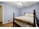 Charming bedroom features a hardwood floor, ceiling fan, and wooden bed frame at 3294 Francine Dr, Decatur, GA 30033