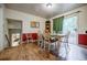 Inviting dining room featuring wood floors, and glass doors leading to a deck, perfect for entertaining at 3294 Francine Dr, Decatur, GA 30033