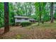 Two-story home surrounded by mature trees, offering a private and serene setting at 3294 Francine Dr, Decatur, GA 30033