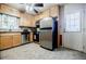 Functional kitchen with stainless steel appliances, wood cabinets, and a bright window at 3294 Francine Dr, Decatur, GA 30033