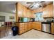 Eat-in kitchen featuring stainless appliances and plenty of cabinet space with easy access to the dining room at 3294 Francine Dr, Decatur, GA 30033