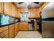 Well-lit kitchen with stainless steel dishwasher and microwave, beautiful countertops, and ample cabinet space at 3294 Francine Dr, Decatur, GA 30033