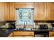Kitchen featuring stainless steel appliances and unique stained glass window above the sink at 3294 Francine Dr, Decatur, GA 30033