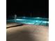 An outdoor community pool is lit with underwater lights at night at 3294 Francine Dr, Decatur, GA 30033