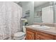 Comfortable bathroom featuring a shower with a curtain, vanity, and mirror at 60 Heaton Dr, Covington, GA 30016