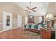 Bright and inviting bedroom with wood flooring, a ceiling fan, and neutral wall tones at 60 Heaton Dr, Covington, GA 30016