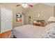 Cozy bedroom featuring vaulted ceiling and a small desk at 60 Heaton Dr, Covington, GA 30016