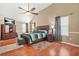 Bright bedroom with a vaulted ceiling, ceiling fan, and wood-look flooring at 60 Heaton Dr, Covington, GA 30016