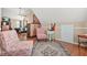 Cozy bonus room with vaulted ceiling, wood floors, comfortable chairs, and lots of natural light at 60 Heaton Dr, Covington, GA 30016