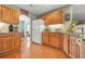 Traditional kitchen with wood cabinets, granite counters, and stainless appliances offers plenty of storage at 60 Heaton Dr, Covington, GA 30016