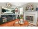Inviting living room featuring a TV, fireplace, and comfortable seating for relaxation at 60 Heaton Dr, Covington, GA 30016