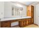 Bathroom with a wide vanity, wooden cabinets, plus white countertop and sink basin at 8464 Pleasant Hill Rd, Lithonia, GA 30058