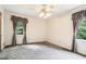 Bedroom with carpet floors, ceiling fan, and natural light at 8464 Pleasant Hill Rd, Lithonia, GA 30058
