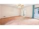 Spacious bedroom with ceiling fan and sliding door to the backyard at 8464 Pleasant Hill Rd, Lithonia, GA 30058