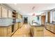 Updated kitchen features a center island, granite countertops, stainless steel appliances, and wood cabinets at 8464 Pleasant Hill Rd, Lithonia, GA 30058