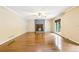 Hardwood floors and natural lighting are focal points in the living room featuring a stone fireplace at 8464 Pleasant Hill Rd, Lithonia, GA 30058