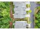 Overhead view showcasing well-maintained townhomes with lush landscaping and mature trees lining the streets at 124 Calder Dr, Alpharetta, GA 30009