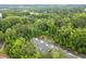Aerial view of townhome community surrounded by lush greenery, offering a serene and private setting at 124 Calder Dr, Alpharetta, GA 30009