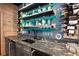 Close up view of the bar showcasing the granite countertop and wine racks at 124 Calder Dr, Alpharetta, GA 30009