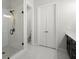Bright bathroom featuring a glass shower, modern fixtures, and neutral tones at 124 Calder Dr, Alpharetta, GA 30009