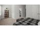 Bedroom featuring a comfortable bed, neutral decor, and view to en-suite bath at 124 Calder Dr, Alpharetta, GA 30009
