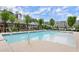 View of the community pool surrounded by lounge chairs and landscaping at 124 Calder Dr, Alpharetta, GA 30009