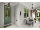 Inviting front porch showcasing painted brick, seating, and a charming green front door at 124 Calder Dr, Alpharetta, GA 30009