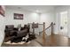 Hallway featuring hardwood floors, leather chairs, and decorative accents at 124 Calder Dr, Alpharetta, GA 30009