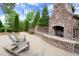 Charming outdoor fireplace with seating area creates a cozy spot for residents to gather and enjoy at 124 Calder Dr, Alpharetta, GA 30009