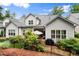 Picturesque patio with outdoor seating and grill, surrounded by lush landscaping and a well-maintained fence for privacy at 124 Calder Dr, Alpharetta, GA 30009