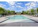 Resort style community pool surrounded by lounge chairs and beautiful landscaping in a desirable neighborhood at 124 Calder Dr, Alpharetta, GA 30009