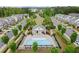 Overhead view of community pool and recreation building surrounded by manicured landscaping in neighborhood at 124 Calder Dr, Alpharetta, GA 30009
