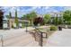 Community pool area with lounge chairs, tables, and well-maintained landscaping at 124 Calder Dr, Alpharetta, GA 30009