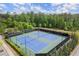 Community tennis courts surrounded by lush greenery offering residents an active lifestyle and recreation at 124 Calder Dr, Alpharetta, GA 30009