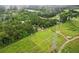 Aerial view of lush greenery and an expansive lot; electric lines are present on the property at 1368 Tommy Lee Cook Rd, Palmetto, GA 30268