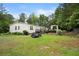 Spacious backyard featuring grass, a wooden deck and garden at 1368 Tommy Lee Cook Rd, Palmetto, GA 30268