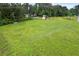 Expansive, green front yard featuring mature trees and electric lines at 1368 Tommy Lee Cook Rd, Palmetto, GA 30268