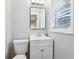 Clean bathroom with white vanity, modern mirror, and natural light from window at 3036 Horse Shoe Se Dr, Atlanta, GA 30316